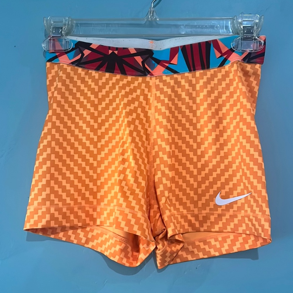 Orange Nike pros